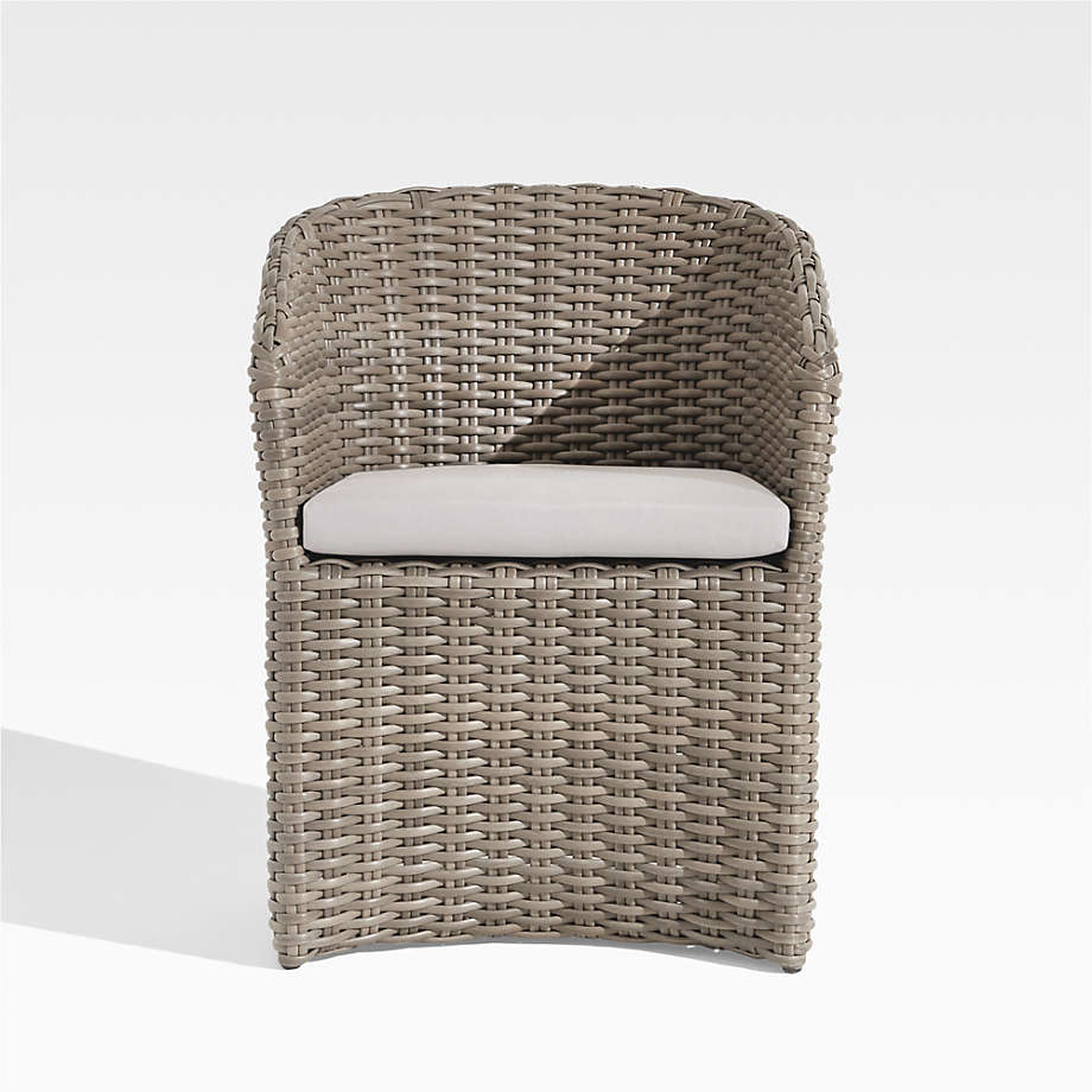 Abaco Resin Wicker Outdoor Dining Chair with White Sand Sunbrella ® Cushion - Crate and Barrel