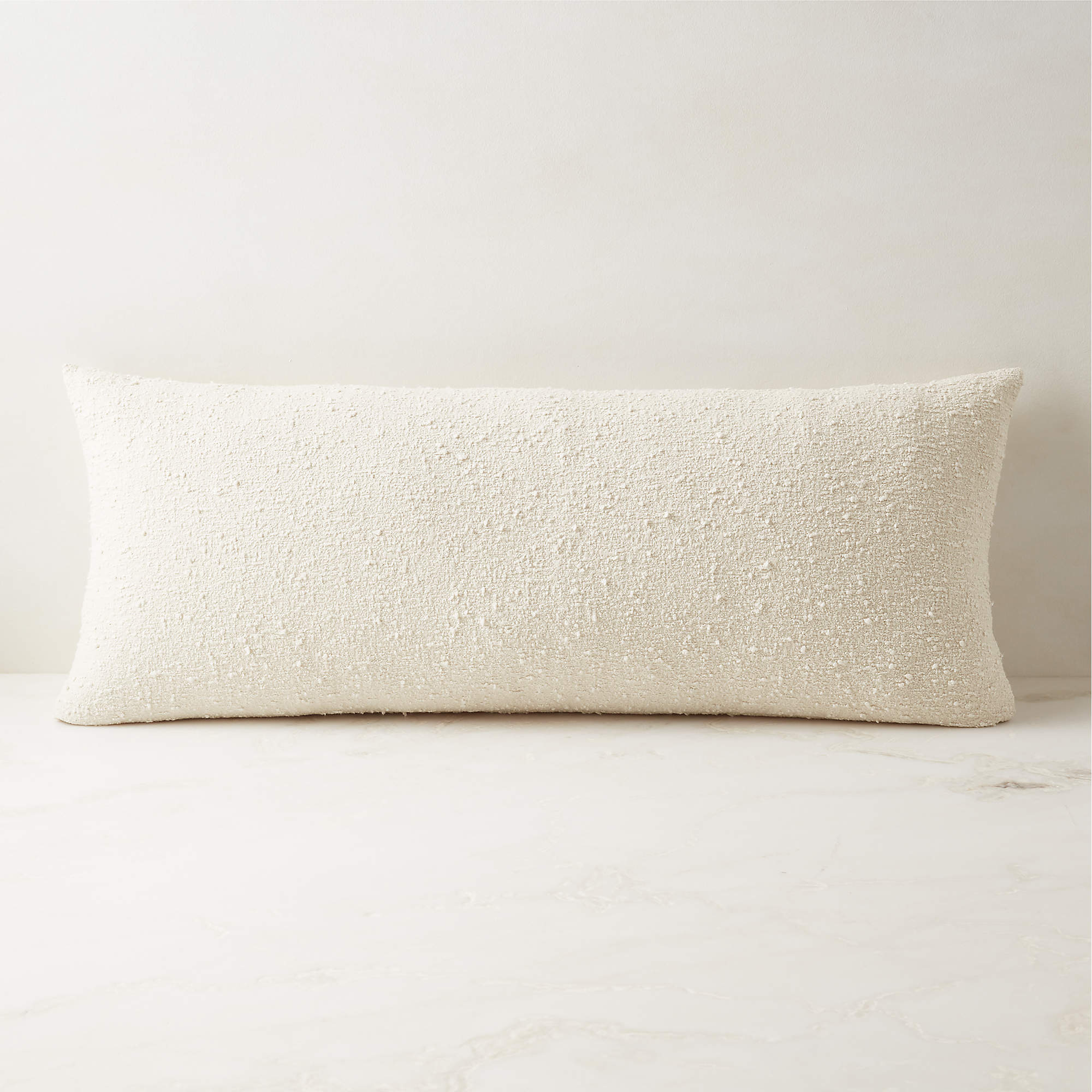 Ivory Boucle Throw Pillow with Down-Alternative Insert 36"x16" - CB2
