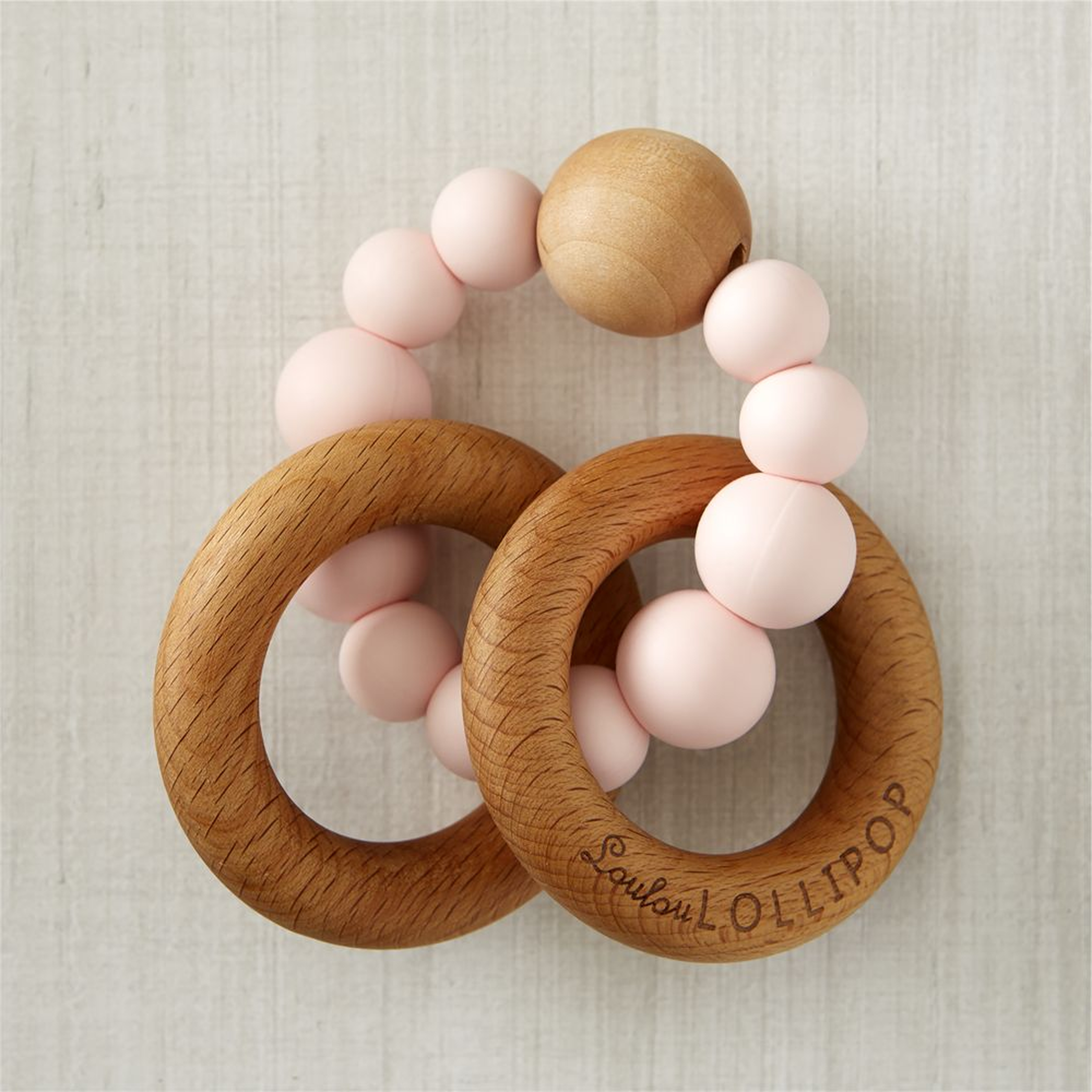 Loulou Lollipop Wood and Pink Silicone Baby Teether - Crate and Barrel