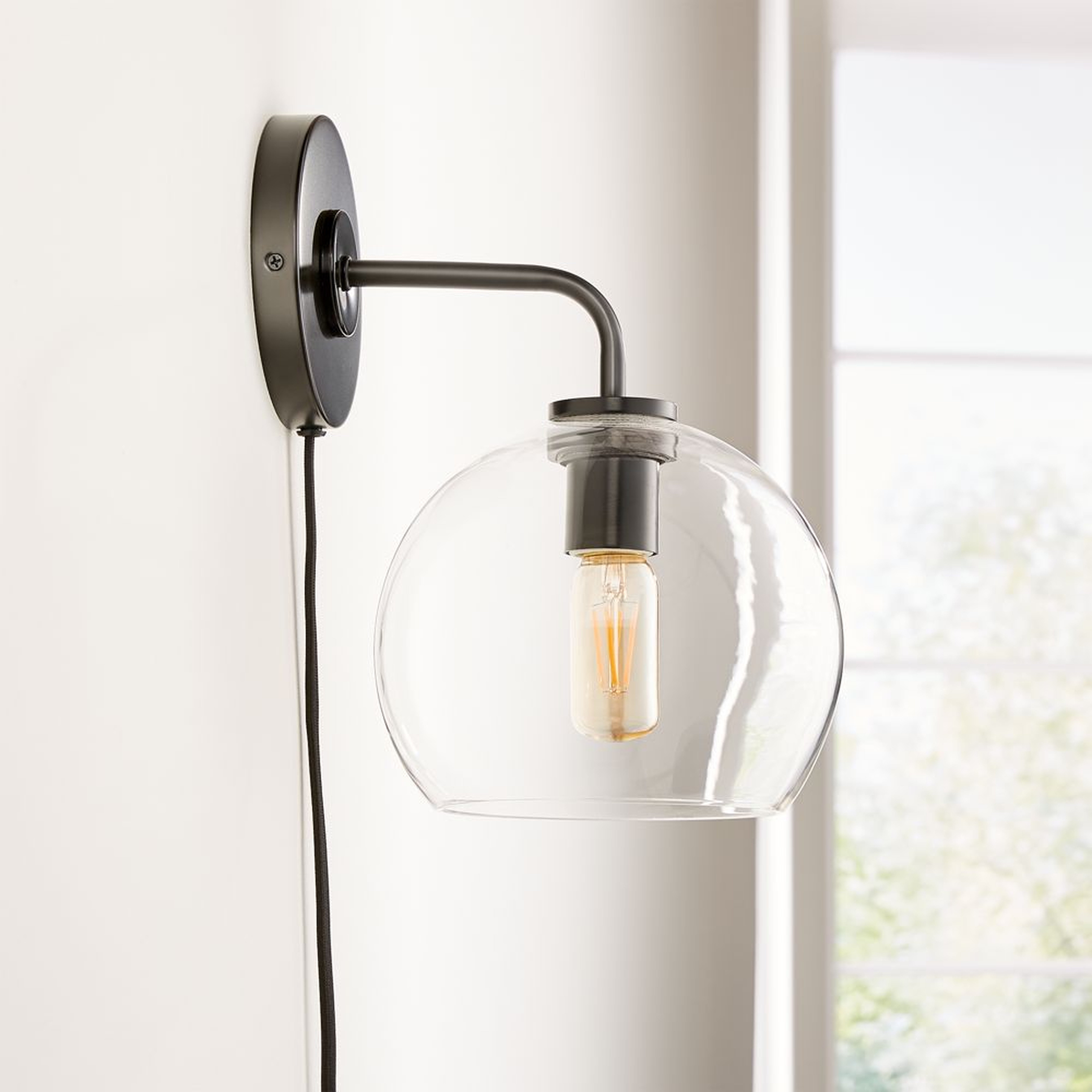 Arren Black Plug In Wall Sconce Light with Clear Round Shade - Crate and Barrel