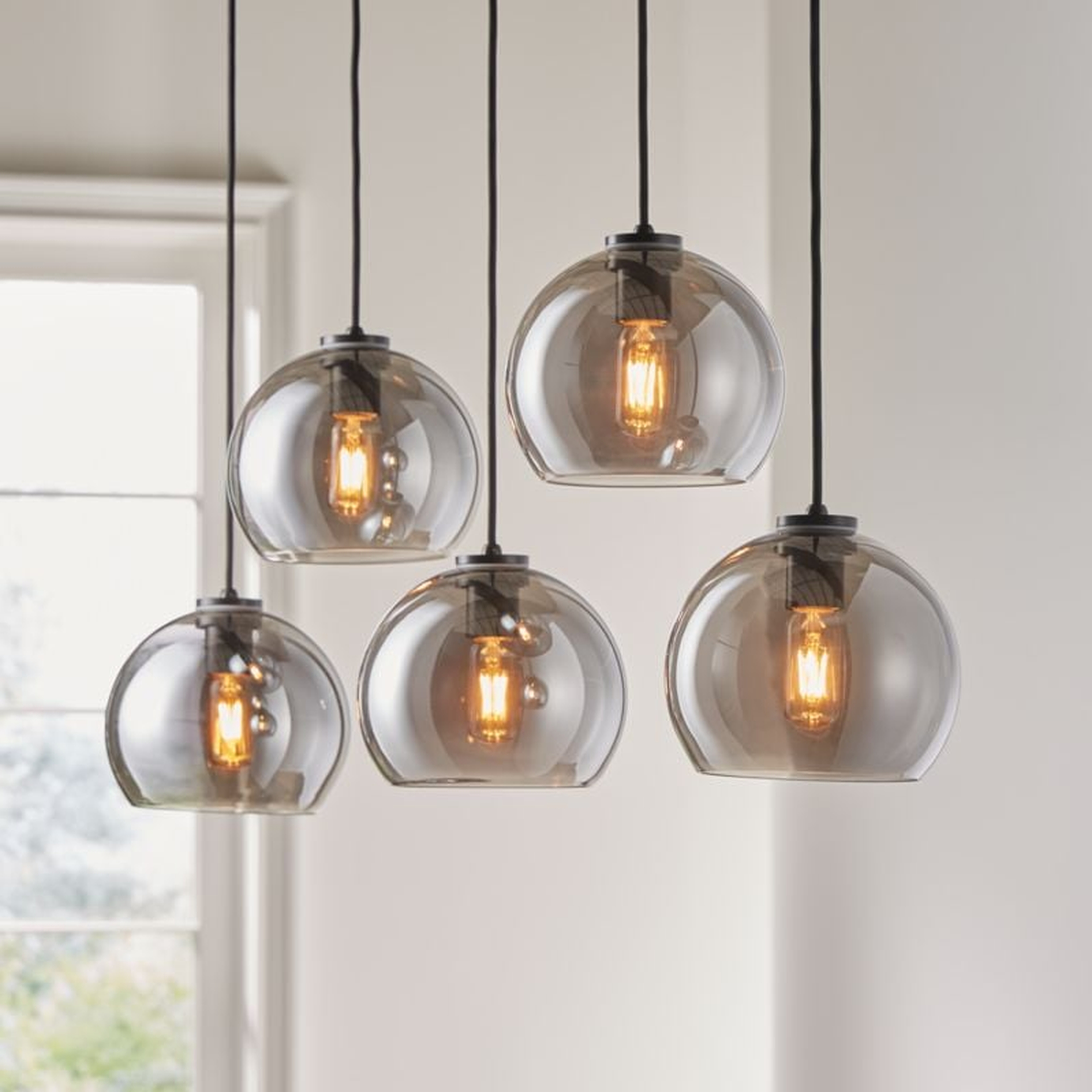 Arren Black 5-Light Linear Pendant with Round Silver Glass Shades - Crate and Barrel