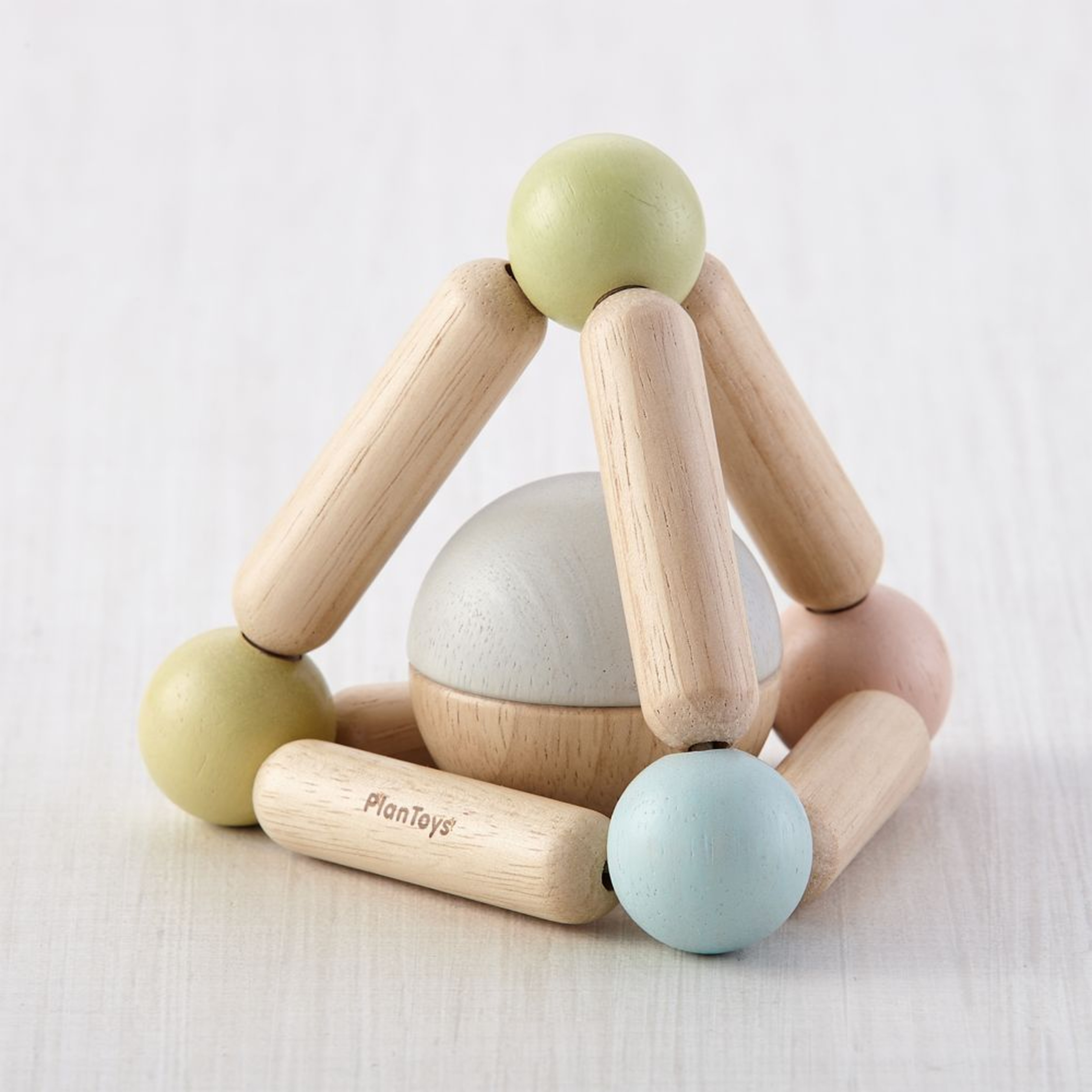 Plan Toys Pastel Triangle Clutching Toy - Crate and Barrel