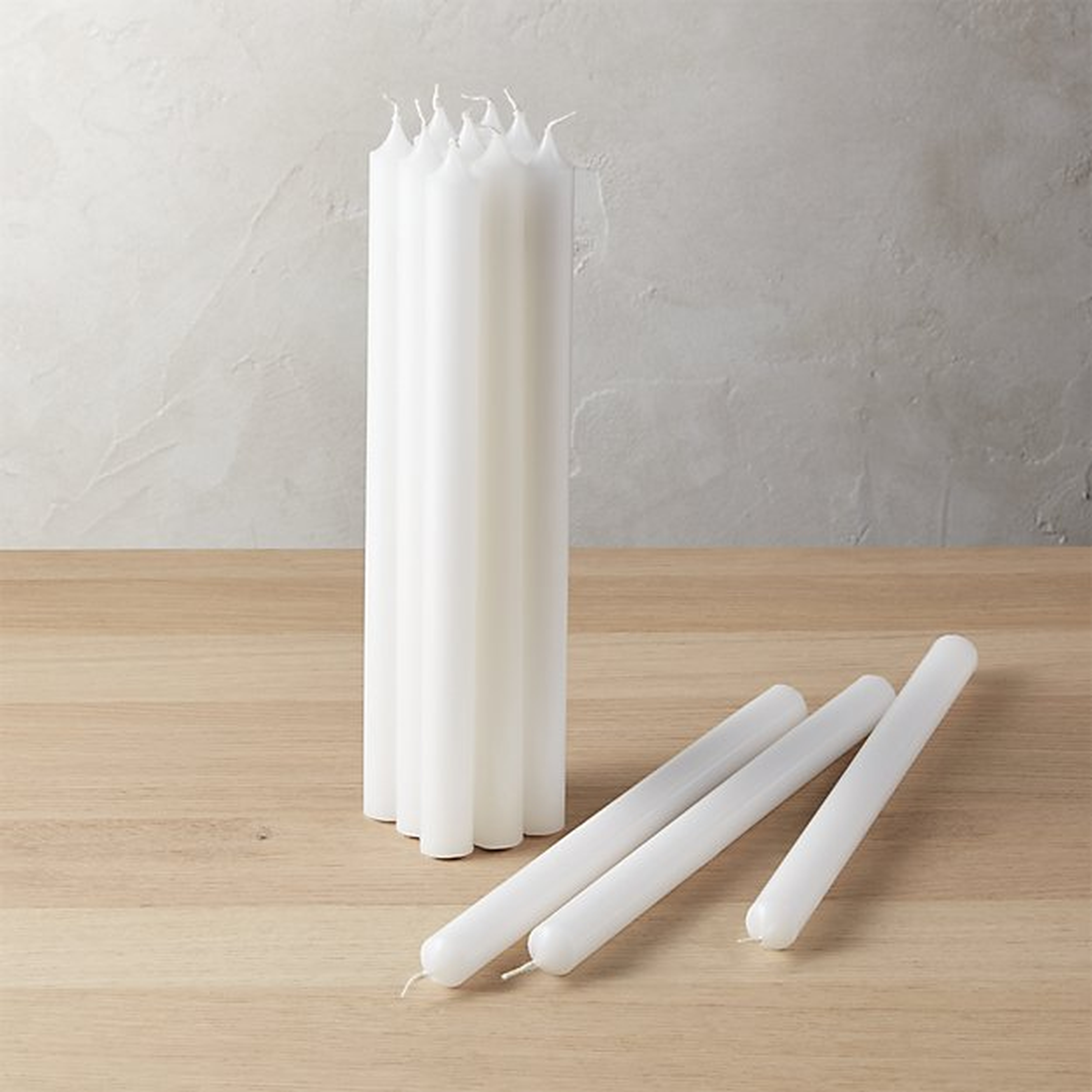 set of 12 white taper candles - CB2