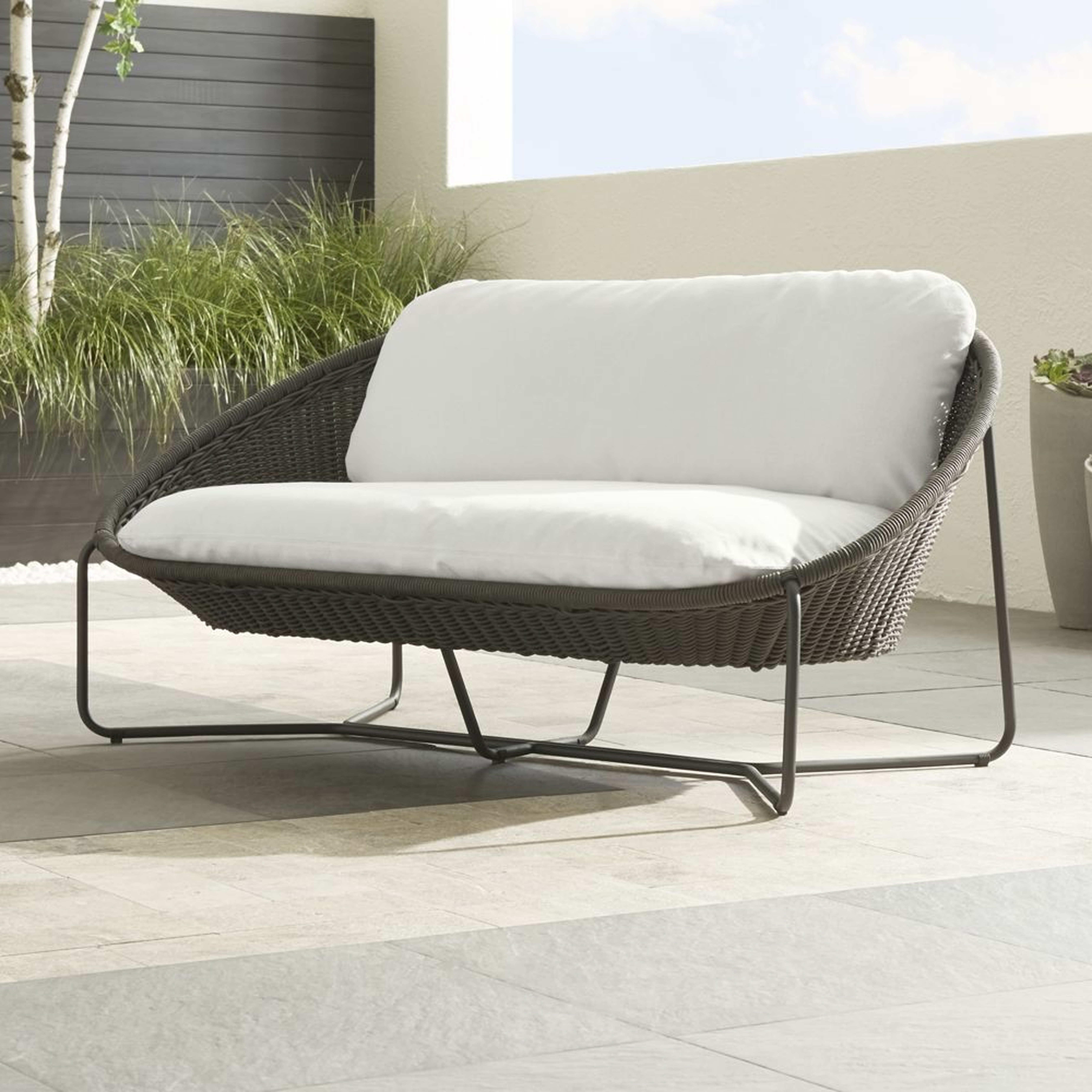 Morocco Graphite Oval Outdoor Loveseat with White Cushion - Crate and Barrel