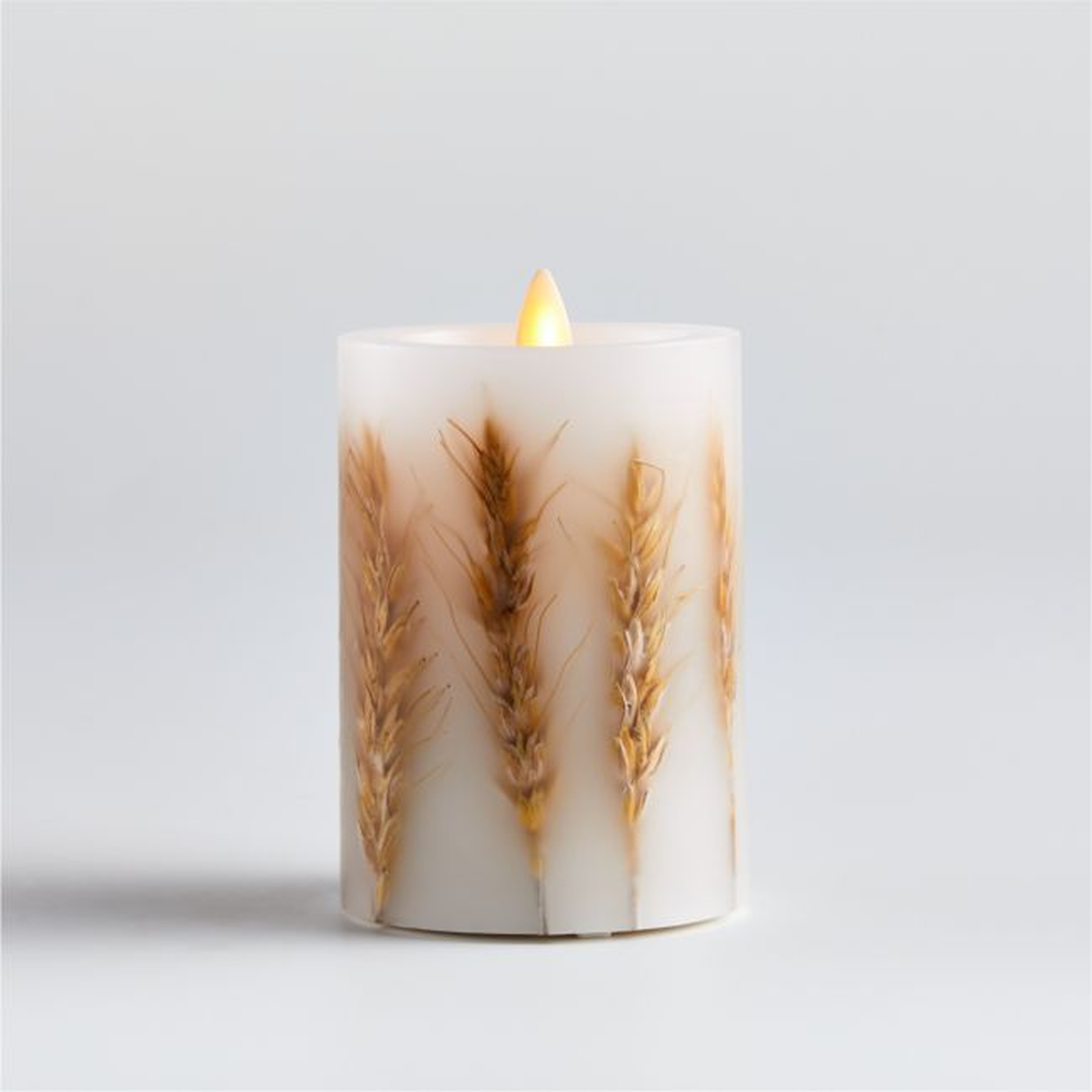 Flickering Flameless 3"x4" Wheat Inclusion Wax Pillar Candle. - Crate and Barrel