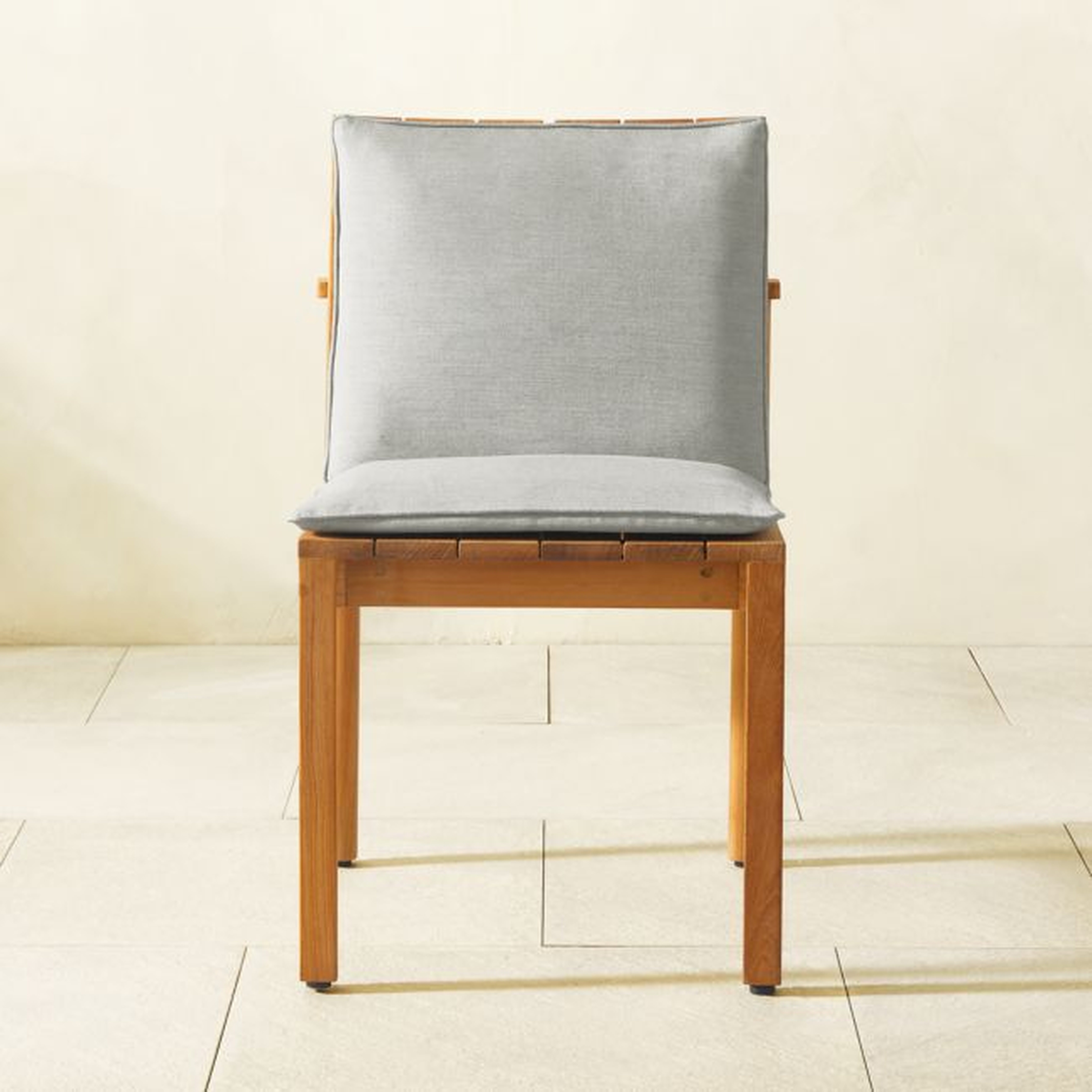 Cabra Teak Outdoor Dining Chair with Grey Sunbrella® Cushion - CB2