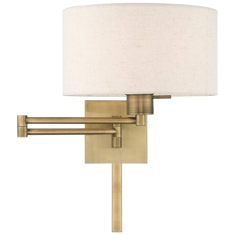 Antique Brass Swing Arm Wall Lamp with Oatmeal Drum Shade - Image 0