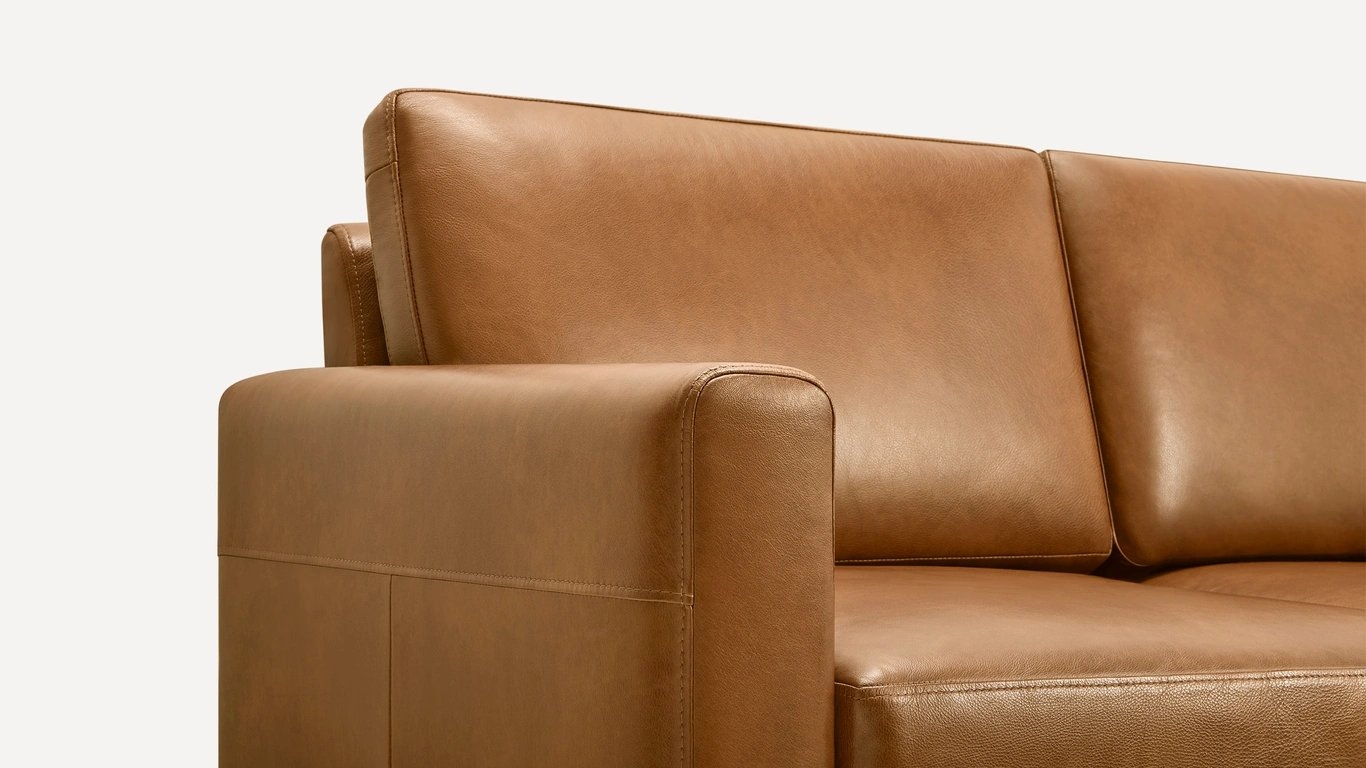 The Block Nomad Leather Armchair with Ottoman in Camel - Image 1