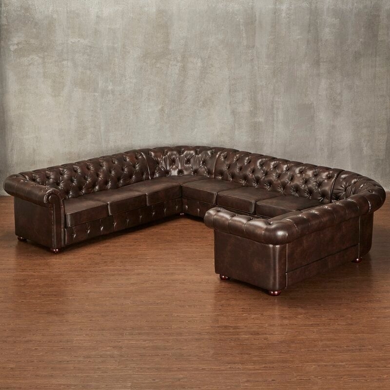 Lucious 142" Wide Faux Leather Symmetrical Large Sectional - Image 1