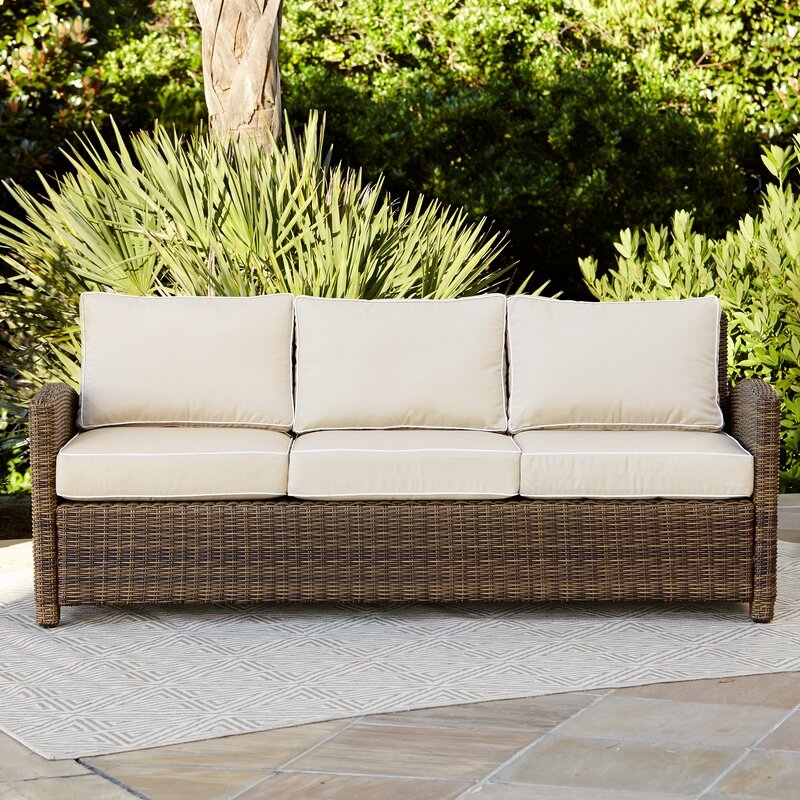 Lawson 80.5" Wide Outdoor Wicker Patio Sofa with Cushions - Image 1