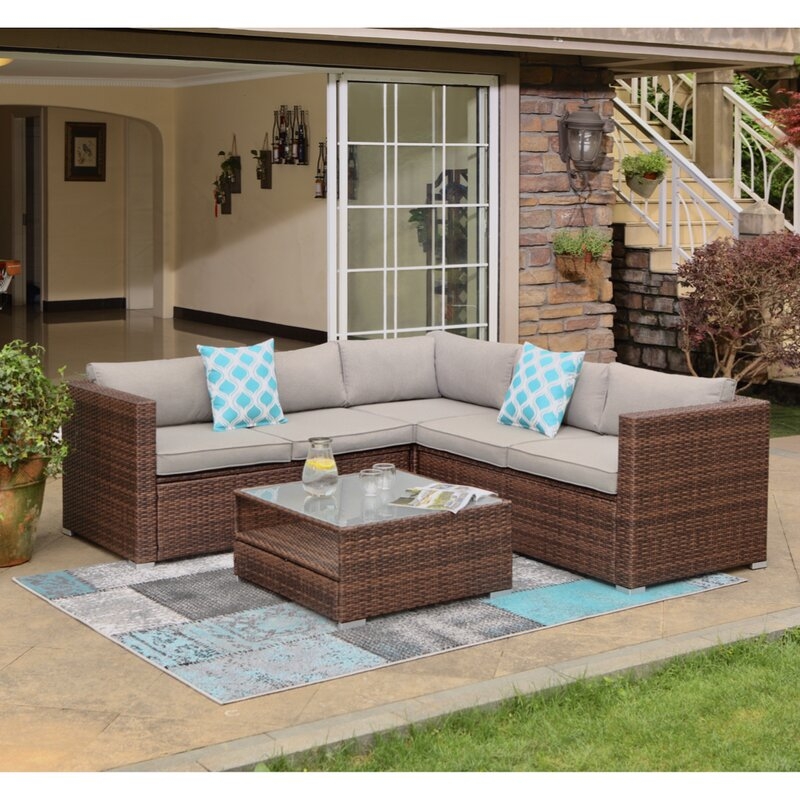 Newagen 4-Piece Outdoor Furniture Set Mottlewood Brown Wicker Sofa W Warm Gray Cushions, Glass Coffee Table, 2 Teal Pillows Incl. Waterproof Cover - Image 1
