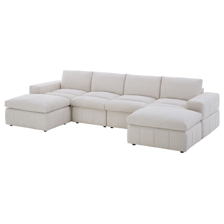 Durah 134" Wide Reversible Modular Sectional with Ottoman - Image 1