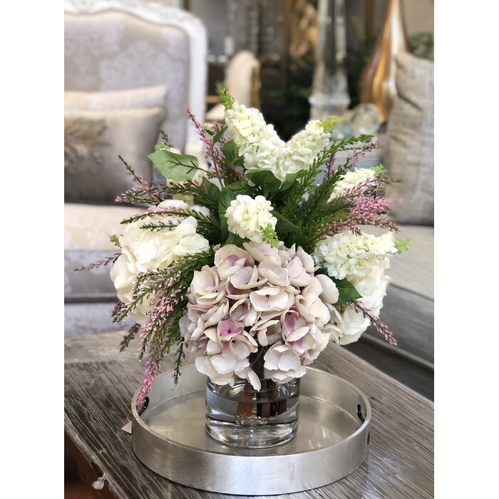 Hydrangea and Lilac Floral Arrangement and Centerpiece in Glass Vase - Image 0