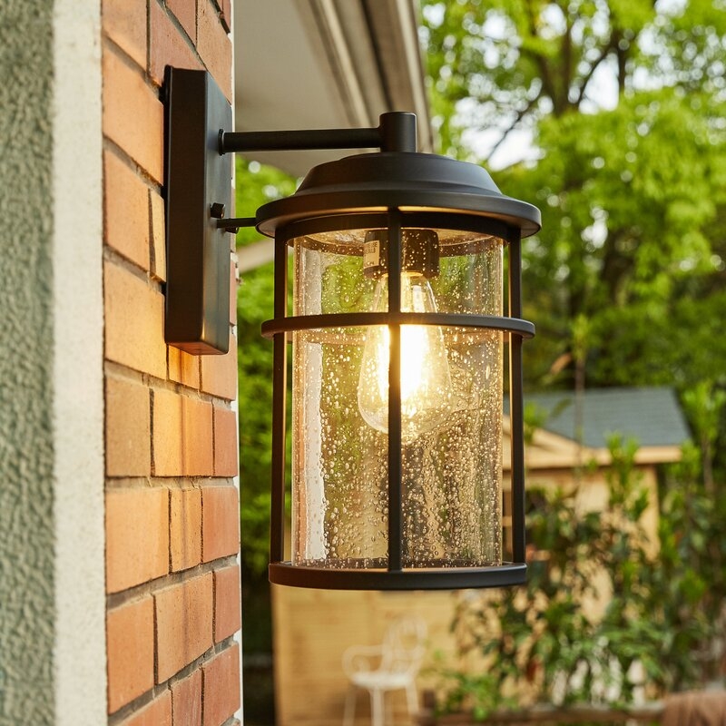 Ellenor Black/Clear 11.92'' H Seeded Glass Outdoor Wall Lantern - Image 1