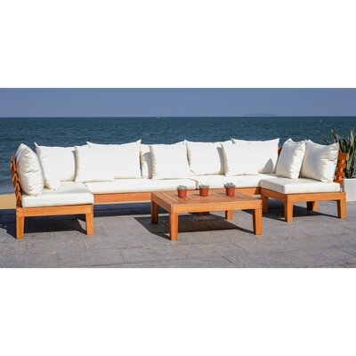 Greta Living Patio Sectional with Cushions - Image 0