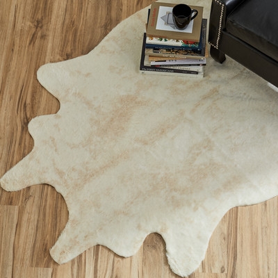 Hand-Tufted Faux Cowhide Ivory Area Rug - Image 0