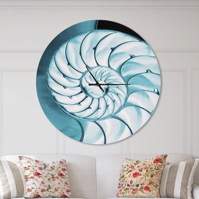 Designart Chambe Nautilus Shell Coastal Wall Clock - Image 0