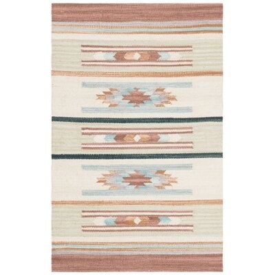 Halle Hand-Loomed Cotton Brown Area Rug - Image 0