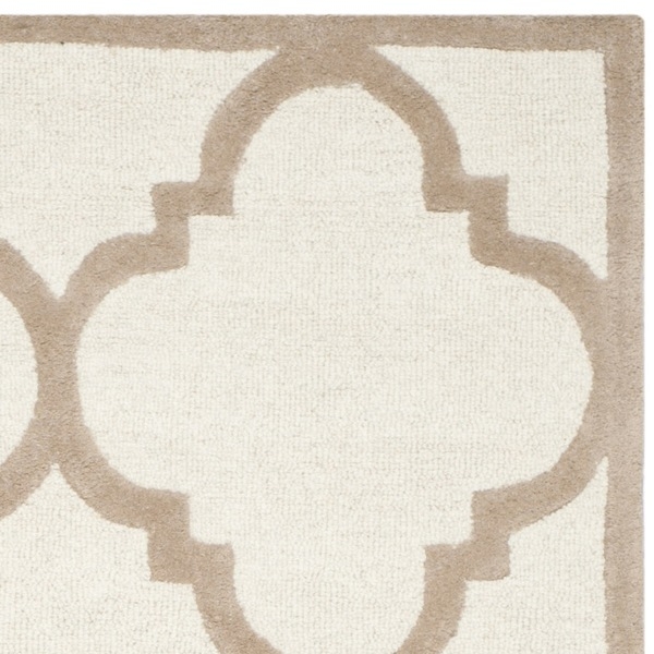 Handmade Moroccan Cambridge Ivory/ Beige Wool Rug (6' x 9') - Image 1