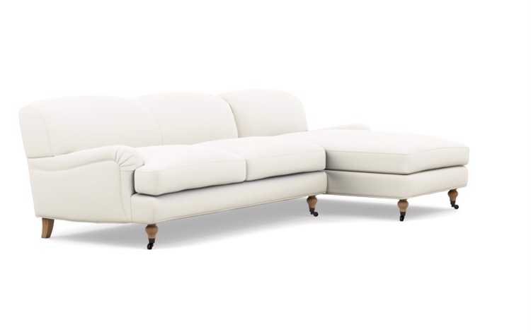 Rose by The Everygirl Chaise Sectional in Ivory Fabric with White Oak with Antiqued Caster legs - Image 1