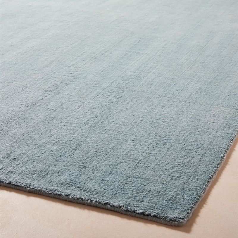 Lyla Handloomed Silver Blue Solid Performance Area Rug 5'x8' - Image 1