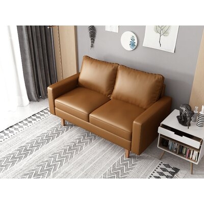 Kevia 57.9'' Vegan Leather Square Arm Loveseat with Reversible Cushions - Image 0