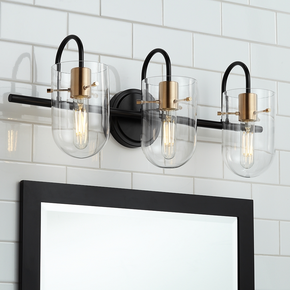 Possini Euro Solomon 24" Wide Brass and Black 3-Light Bath Light - Image 0