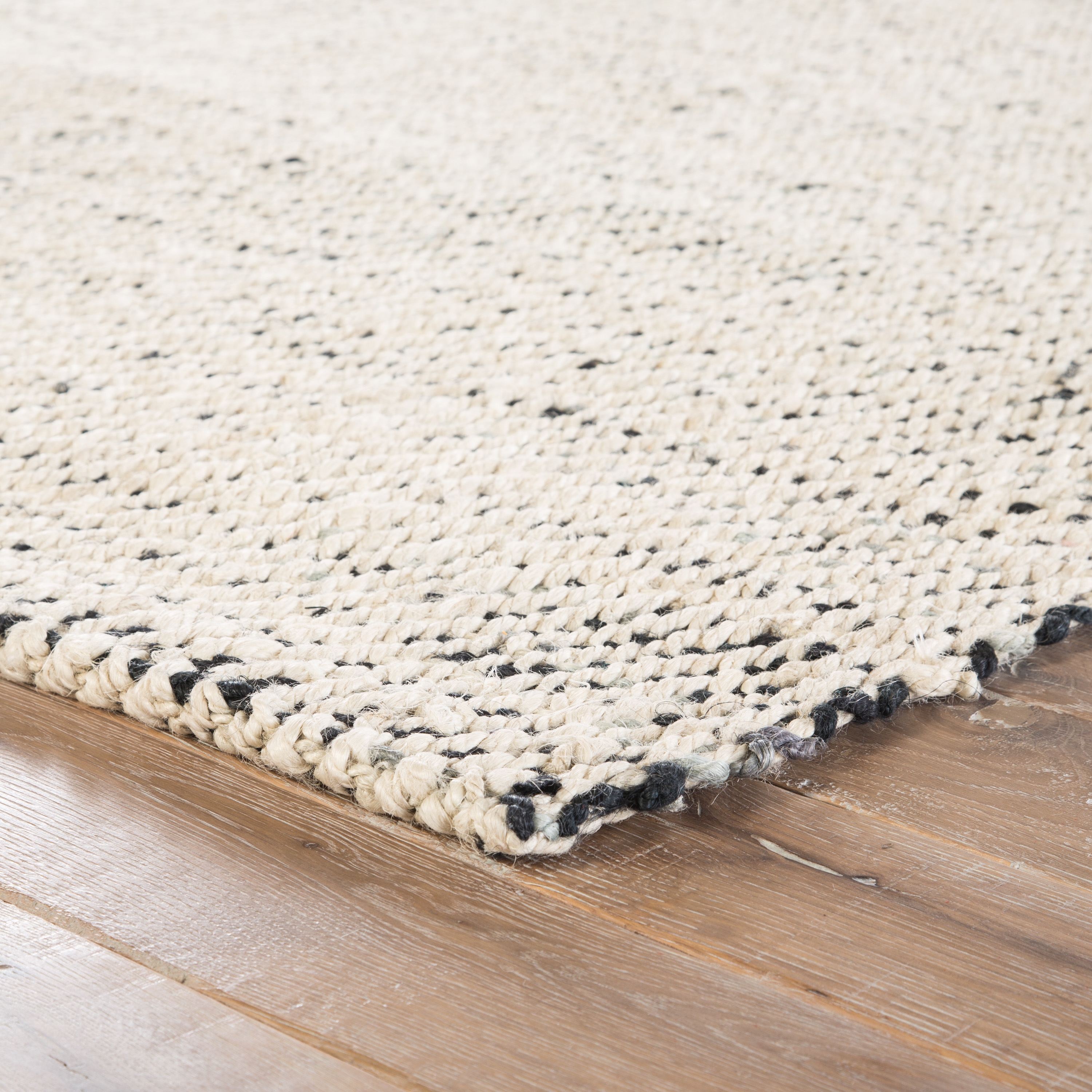 Almand Natural Solid White/ Black Area Rug (9' X 12') - Image 1