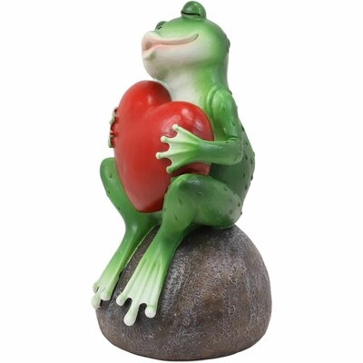 Bayou Breeze Hearts And Kisses Romantic Green Frog Blowing A Kiss With Pouted Lips While Hugging An Oversized Red Heart Decorative Figurine 6.25"H Frogs Toad Toads Fairy Tale Fable Nursery Rhymes Statue - Image 0
