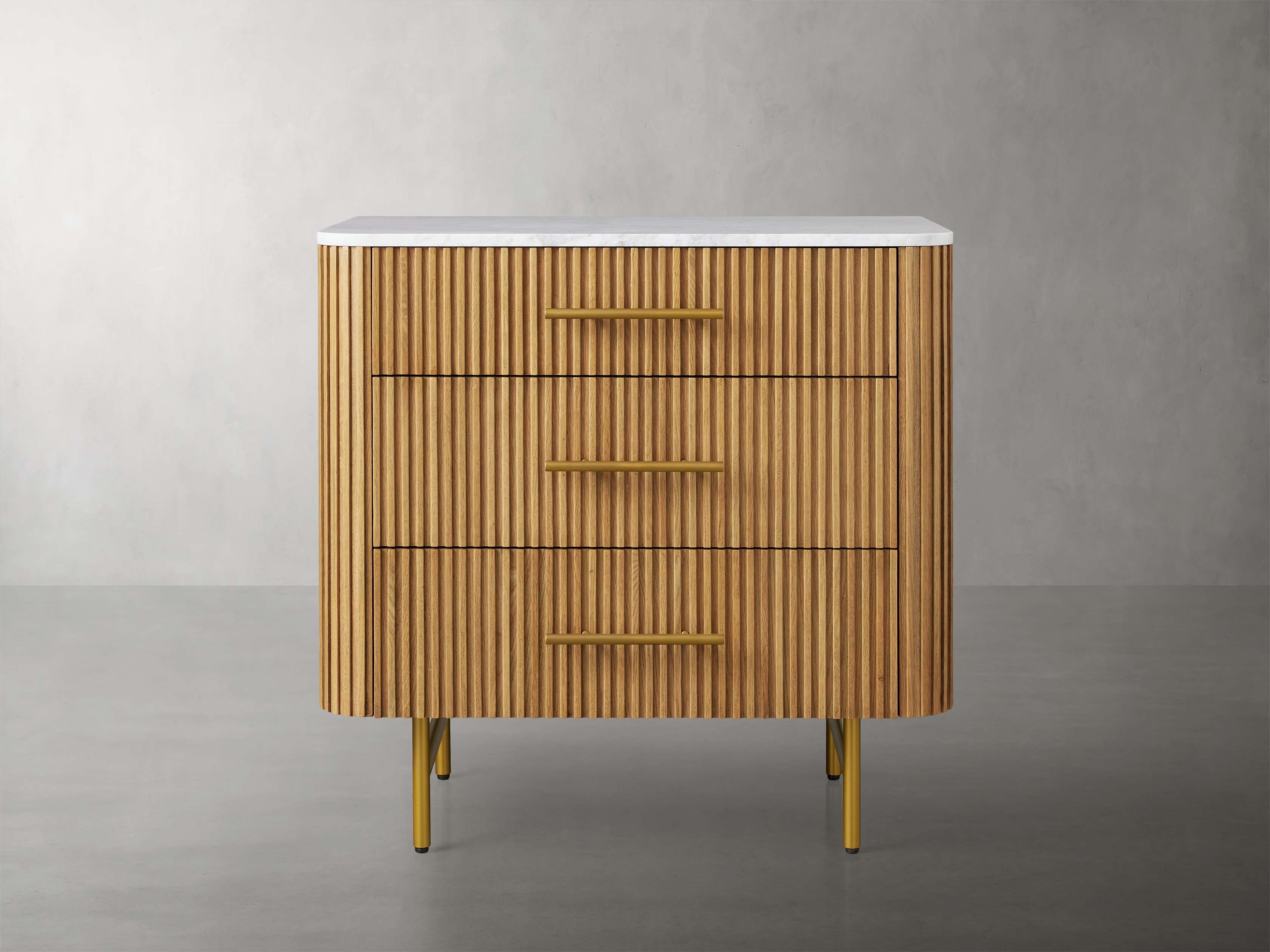 Finnley Three-Drawer Chest in Stone Natural  Carrara/Honey - Image 0