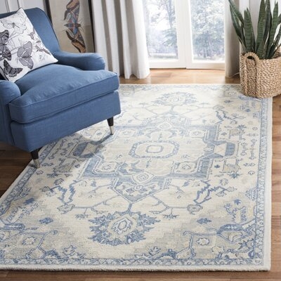 Cuvier Oriental Handwoven Wool Ivory/Blue Area Rug - Image 0
