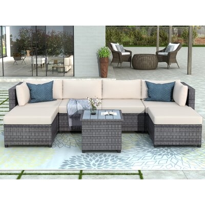 Saluda 7 Piece Rattan Sectional Seating Group with Cushions - Image 0