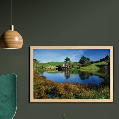 Ambesonne Hobbits Wall Art With Frame, Hobbit Land Village House By Lake With Stone Bridge Farmhouse Cottage New Zealand, Printed Fabric Poster For Bathroom Living Room Dorms, 35" X 23", Green Blue - Image 0