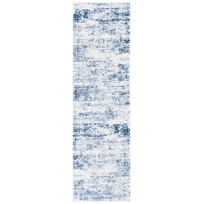 Justine Abstract Ivory/Navy Indoor Area Rug - Image 0