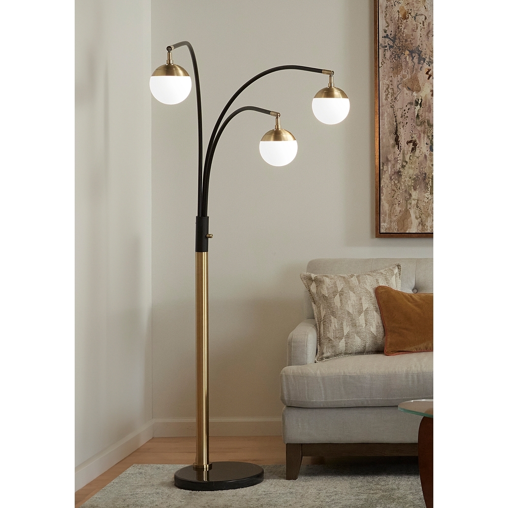Possini Euro Rayne 72" Warm Gold and Black 3-Light Arc Floor Lamp - Image 0