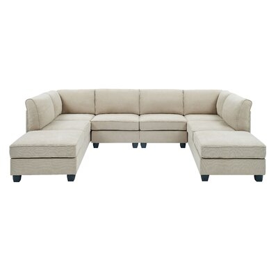 Heger 120" Wide Reversible Modular Corner Sectional with Ottoman - Image 0