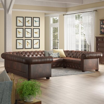 Lucious 142" Wide Faux Leather Symmetrical Large Sectional - Image 0