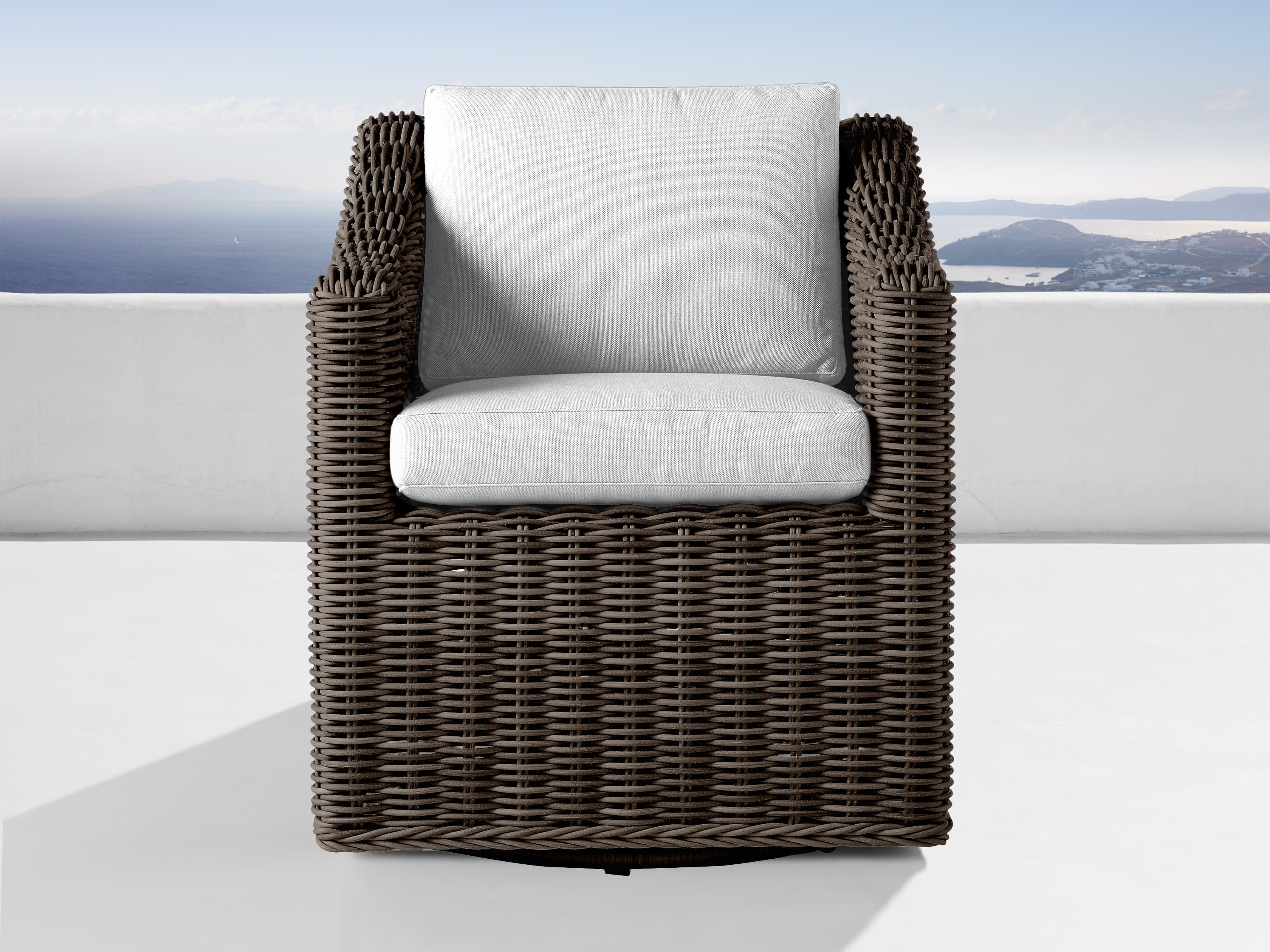 Montauk Outdoor Swivel Dining Arm Chair in All Weather Wicker White - Image 0