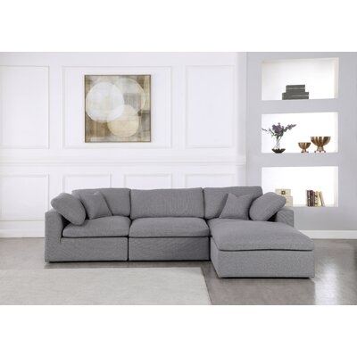 Robesonia 119" Reversible Modular Sectional with Ottoman - Image 0