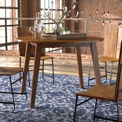 Osya Round Dropleaf Extendable Dining Table - Image 1