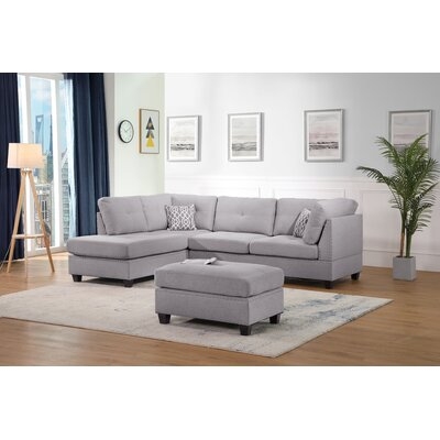 Sunnydale 105" Reversible Sectional with Ottoman - Image 0