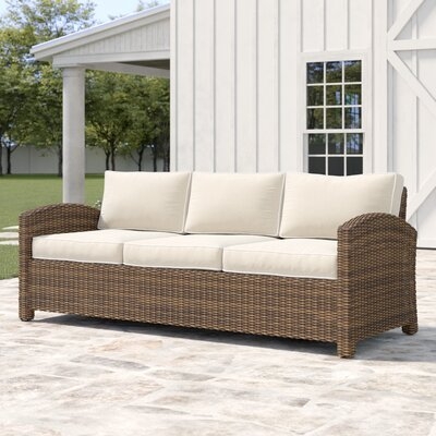 Lawson 80.5" Wide Outdoor Wicker Patio Sofa with Cushions - Image 0