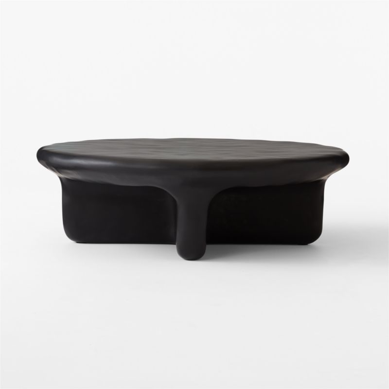 Bodene 50" Round Black Resin Coffee Table - Image 1