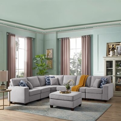 McCoole 123.5" Symmetrical Modular Sectional with Ottoman - Image 0