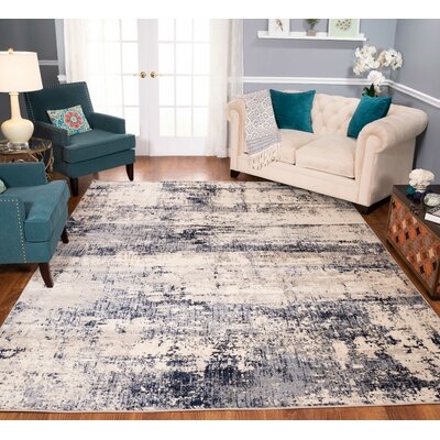 Kelson Abstract Ivory/Blue Area Rug - Image 0
