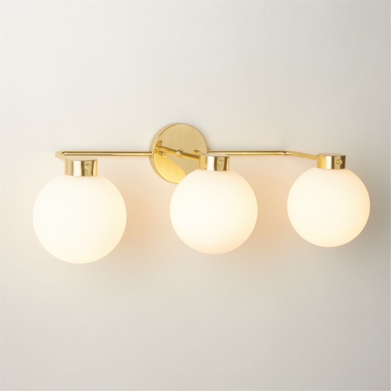 Marra 3-Light Polished Unlacquered Brass Globe Vanity Light - Image 1