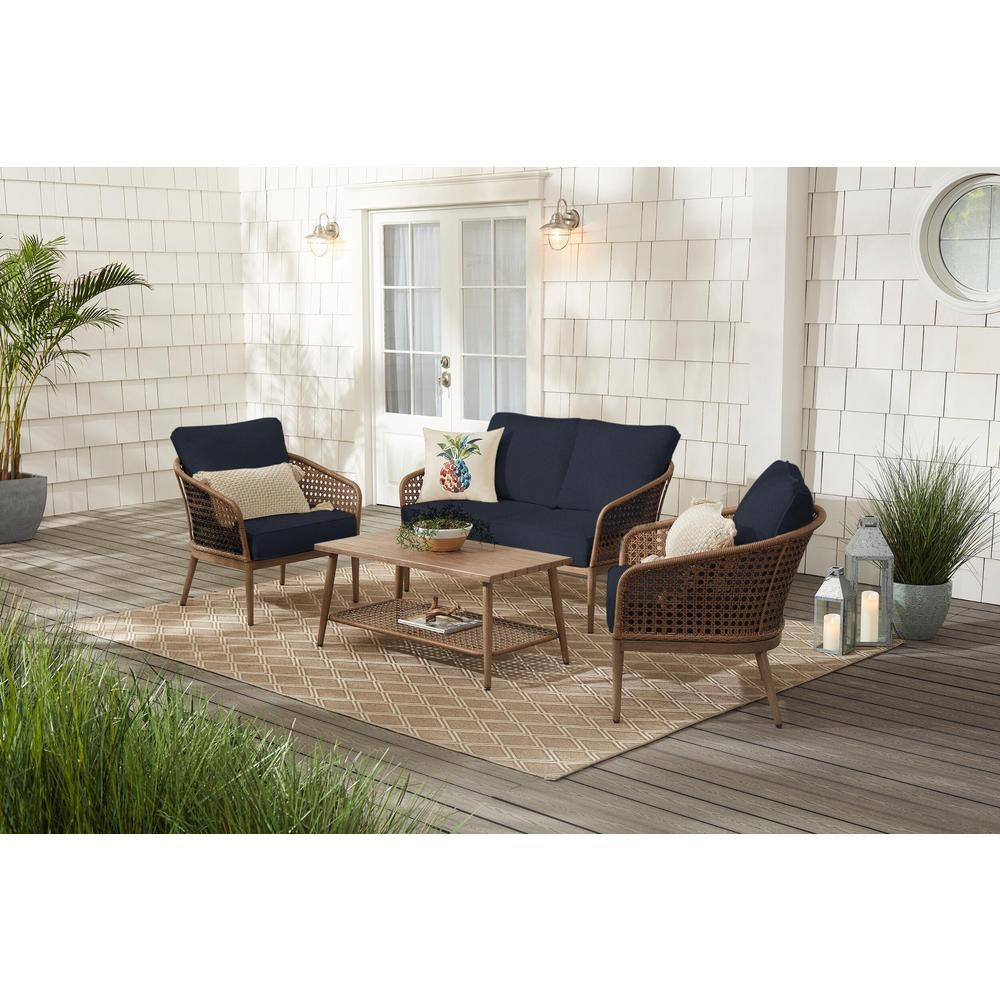 Hampton Bay Coral Vista 4-Piece Brown Wicker and Steel Patio Conversation Seating Set with CushionGuard Midnight Navy Blue Cushions - Image 0