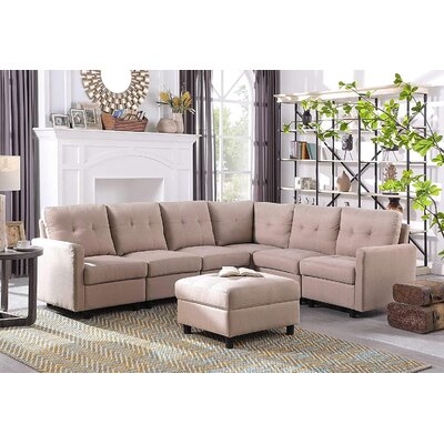 Clayt 103" Wide Symmetrical Modular Corner Sectional with Ottoman - Image 0