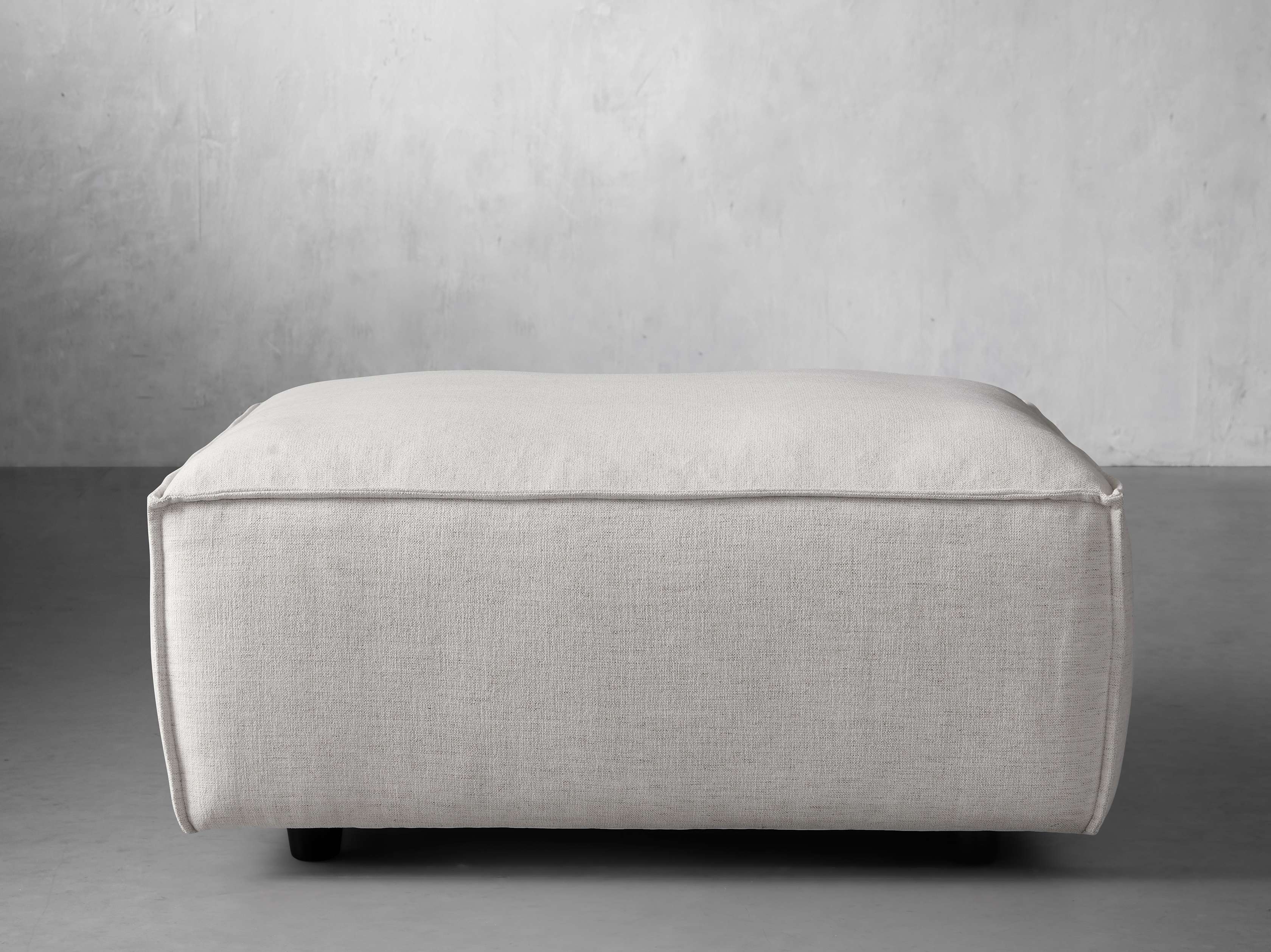 Coburn Ottoman in Upholstered White  Nomad Snow - Image 0