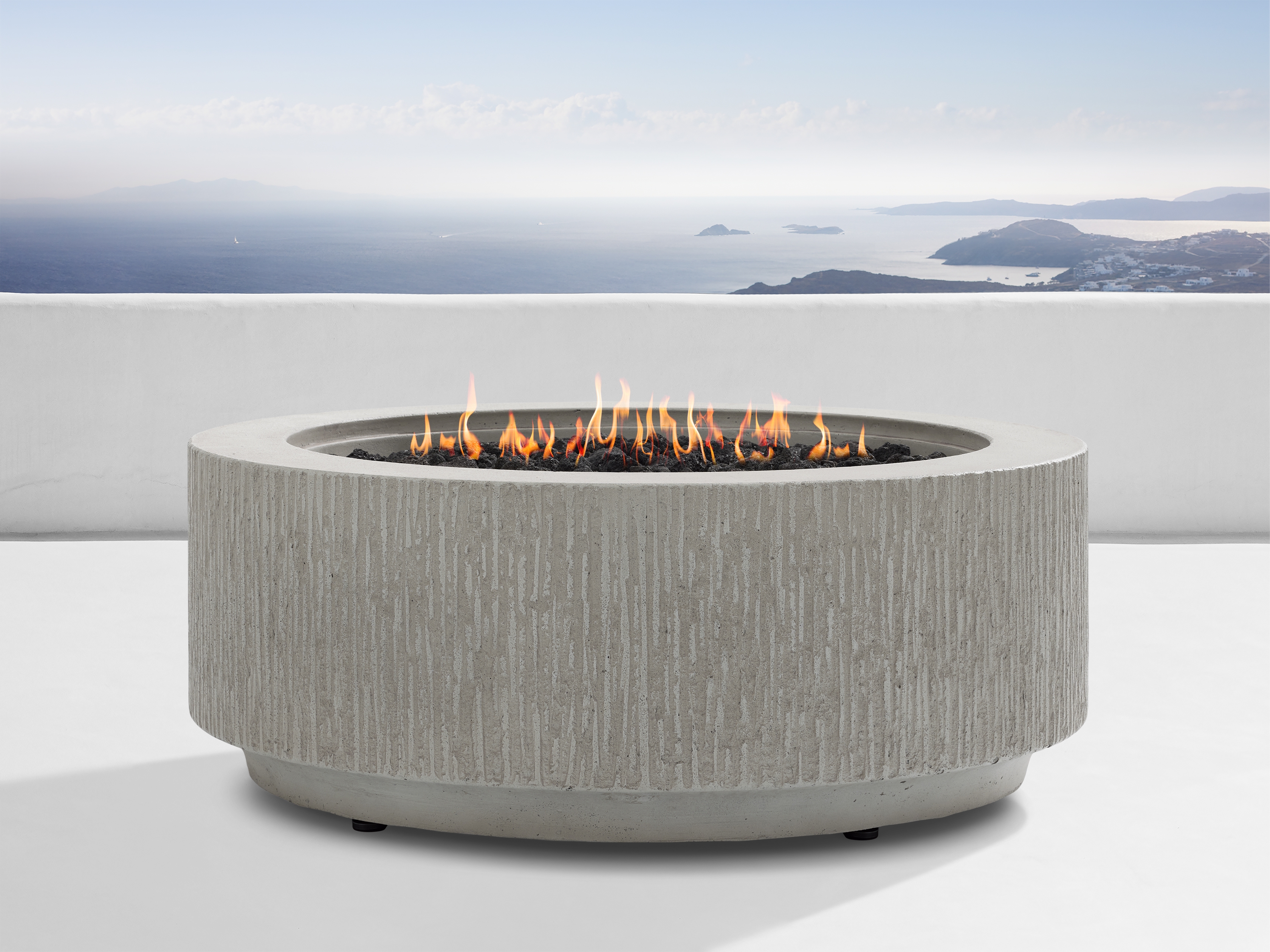 Wilmar Round Natural Gas Fire Pit in Fog Chiseled Stone White - Image 0